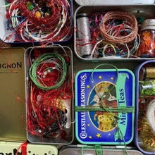 Load image into Gallery viewer, Dropcloth Samplers Sparkle kits, including metallic threads, yarns, beads and sequins in an upcycled breath mints tin. Add sparkle to your embroidery project!