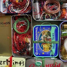 Load image into Gallery viewer, Dropcloth Samplers Sparkle kits, including metallic threads, yarns, beads and sequins in an upcycled breath mints tin. Add sparkle to your embroidery project!