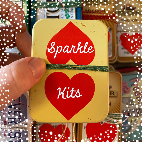 Dropcloth Samplers Sparkle kits, including metallic threads, yarns, beads and sequins in an upcycled breath mints tin. Add sparkle to your embroidery project!