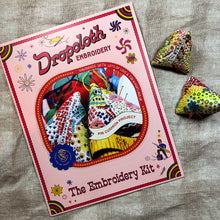 Load image into Gallery viewer, Dropcloth Embroidery Pin Cushion Project kit. Each kit includes sampler for two pin cushions, instructions, threads, stuffing, walnut shells, needles, and a free trial for a Creativebug class. 
