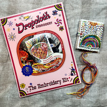 Load image into Gallery viewer, Dropcloth Embroidery Strawberry Needle Book kit. Each kit includes sampler for one needlebook, instructions, threads, wool for the inside lining, one snap, one ribbon, and a free trial for a Creativebug class. 
