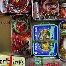Load image into Gallery viewer, Dropcloth Samplers Sparkle kits, including metallic threads, yarns, beads and sequins in an upcycled breath mints tin. Add sparkle to your embroidery project!
