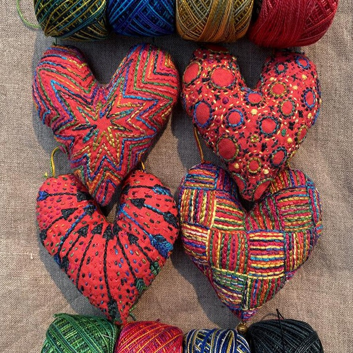 Dropcloth Samplers design: Heart Ornaments. 4 different heart designs are included ready to embroider and turn into ornaments. Includes step-by-step instructions.